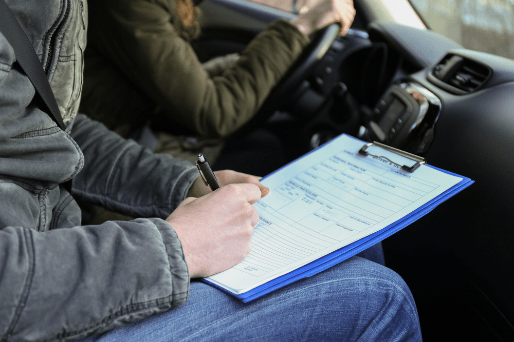 A confident student practicing essential driving lessons tips with an instructor in Ottawa